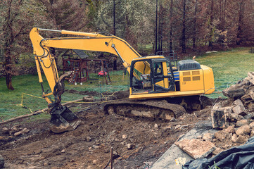 Industrial construction, clearing of the territory for construction by the excavator.