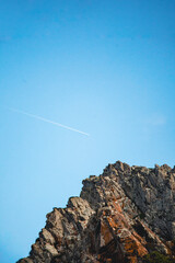 Airplane trail in the sky at Ursa beach, Portugal