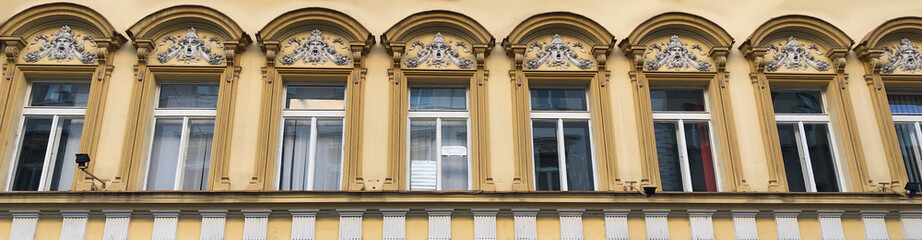 Banner photo of windows and screaming faces