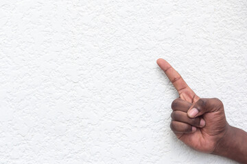Black African man hand pointing one finger up