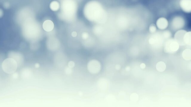 Winter background blue bokeh snow particles.  4K seamless looping Christmas background	