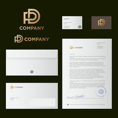 P and D letters. P, D monogram consist of crossed gold elements. Identity, corporate style. Blank letterhead, envelope, letter, business card.