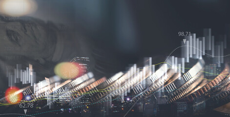 Double exposure of row of coin, US dollar bank note and the city with financial graph for business, finance and investment background