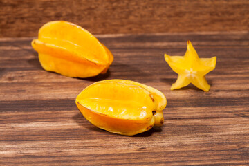 Averrhoa Carambolo - Star Fruit Or Carambola; Photo On Wooden Background