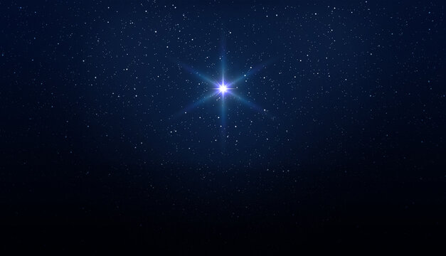 Bright star on the starry night sky.Christmas star of the Nativity of Bethlehem, Nativity of Jesus Christ. Background of the beautiful dark blue starry sky and bright