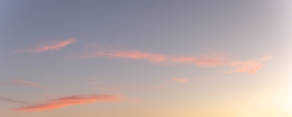 Glowing sky at dusk on a fall evening. Banner, panoramic.