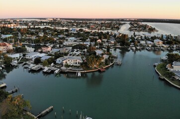 Fototapeta premium The aerial view of the waterfront homes during early morning near John Pass, Madeira Beach, Florida, U.S.A