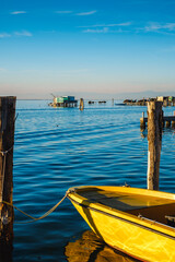 View on the Venetian lagoon with the  fishermen's houses and boat, Pellestrina island, Venetian lagoon, Italy