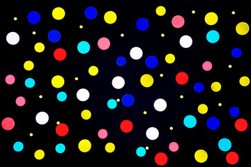 colored tinsel on a black background