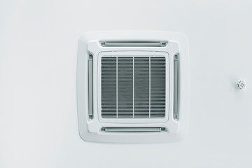 Ceiling сassette air conditioner and fire alarm sensor in the interior.