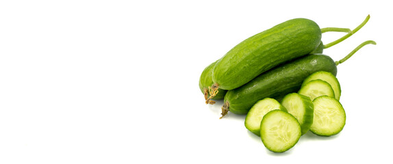 Ripe cucumbers on a white background. Close-up sliced cucumber. Empty space for text. copy space