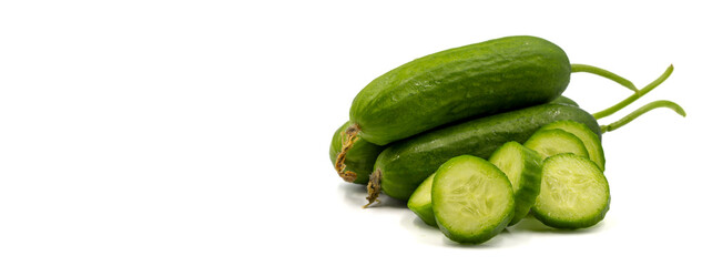 Ripe cucumbers on a white background. Close-up sliced cucumber. Empty space for text. copy space