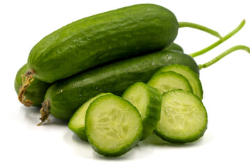 Ripe cucumbers on a white background. Close-up sliced cucumber.