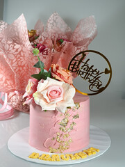 Custom make vanilla sponge cake with fresh flowers and edible gold color patches with a cupcake bouquet