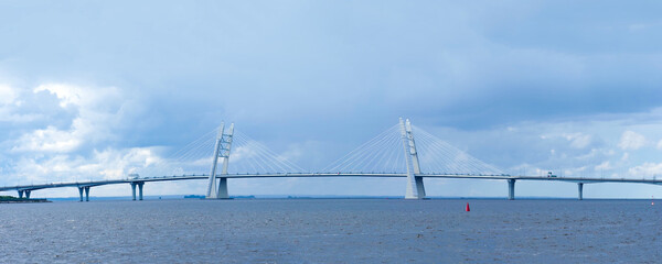 Cable stayed pylon bridge over the Ship fairway, panoramic view. Road bridge on the highway of the...