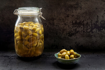 Pickled cucamelon in jar. Preserved canned food from own garden.