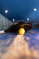 paddle tennis rackets and balls on court