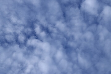 Beautiful white fluffy clouds on a deep blue sky