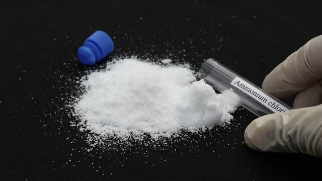 ammonium chloride in test tube and black background