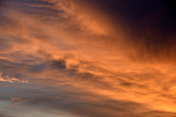 Fototapeta na wymiar Evening beautiful stormy sky in an industrial city