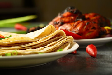 Indian flat bread- whole wheat chapatii, chapthi served with chicken fry.