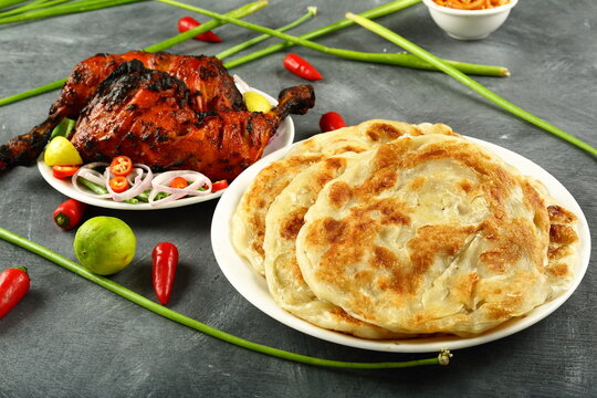 Indian meal- Parathas served with crispy grilled chicken.