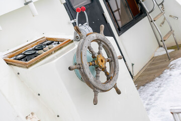 Wooden steering wheel on a yacht
