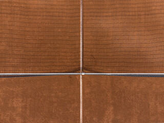 Fototapeta premium Detail of net shadow at gravel clay tennis court seen from above. Drone aerial top down shot
