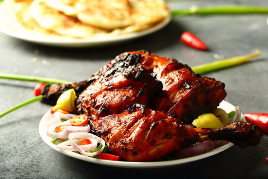 Homemade spicy grilled chicken with exotic Indi9an spices and herbs.