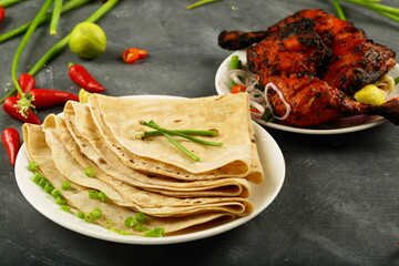 Homemade delicious chapatiis served with spicy grilled chicken. 
