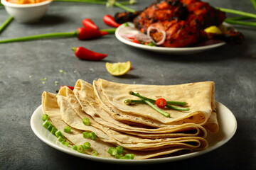 Arabic food cuisine- homemade roti, chapatti, served with tandoori, grilled chicken.