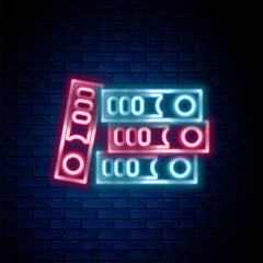 Obraz premium Glowing neon line Office folders with papers and documents icon isolated on brick wall background. Office binders. Archives folder sign. Colorful outline concept. Vector