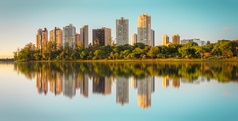 View of Lake Igapó in the city of Londrina in Brazil with modern buildings in the background.