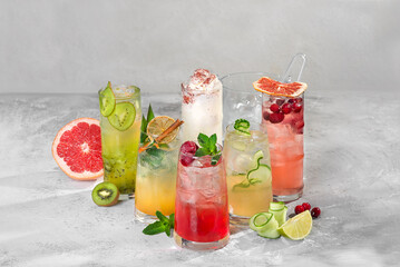Colorful cocktails in different glasses to light
