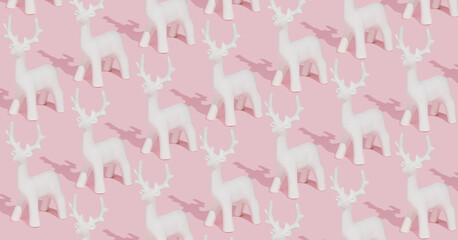 Creative pastel pink winter pattern made with white reindeer ornaments on pink background. Trendy...