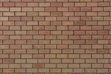 bricks red and broen color arranged in rows on wall