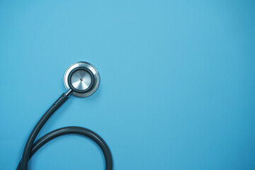 Closeup Stethoscope on pastel blue background with copy space, Health concept.