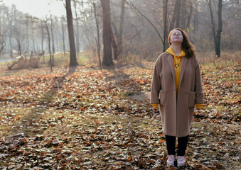 woman walking in autumn park