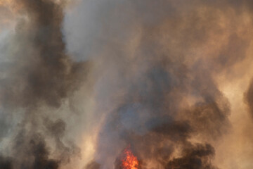 Fototapeta na wymiar raging dust smoke pattern background of fire burn in grass fields, forests and black