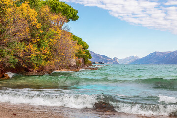 Waves on Lake Garda surrounded by the Alps in the autumn