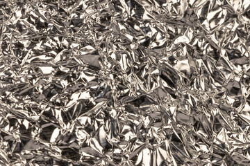 Wrinkled silver metallic texture and background.