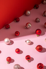 Decorative balls on a pink background. Christmas and New Year concept.