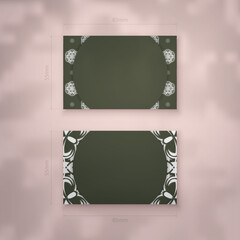 A presentable business card in dark green with a luxurious white pattern for your personality.