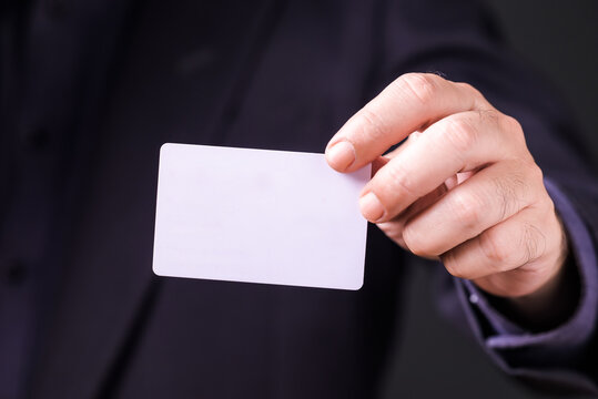 Closeup businessman show the empty white card in front of him
