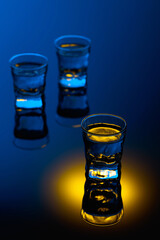 Strong alcoholic drink in color bright lights.