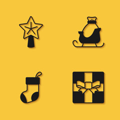 Set Christmas star, Gift box, stocking and santa claus sleigh icon with long shadow. Vector