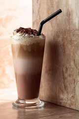 Milk coffee cocktail with whipped cream.
