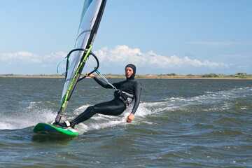 A windsurfer rides in the Black Sea, Russia.