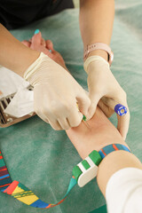 Nurse collecting patient's blood sample for test or donation