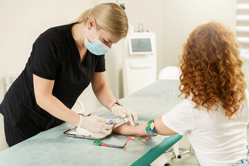 Nurse collecting patient's blood sample for test or donation